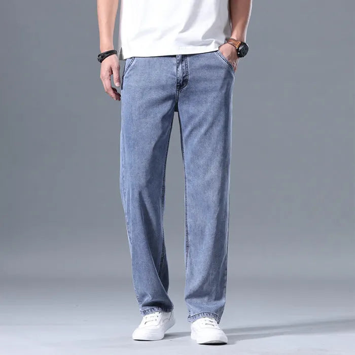 Man wearing light blue loose straight-leg lyocell blend casual jeans.