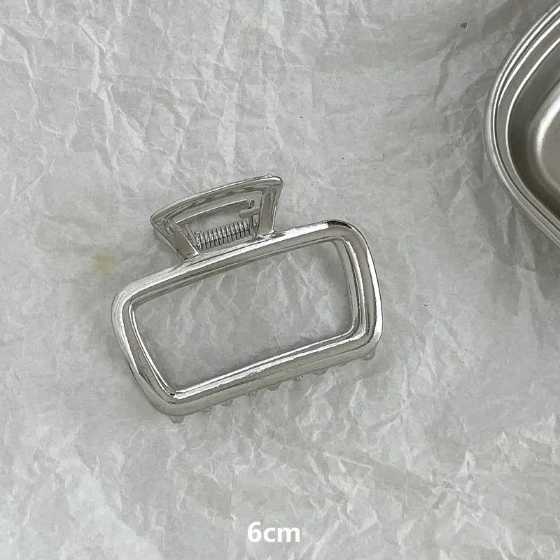 Silver metal hair barrette claw clip with electroplated finish and decorative design