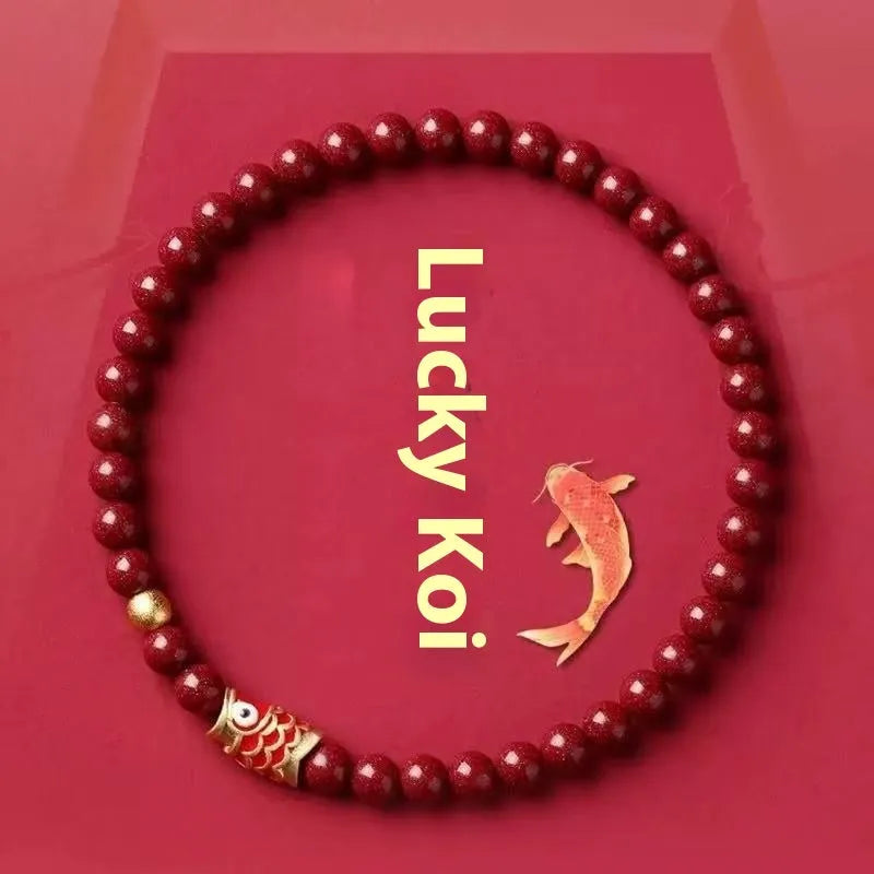 Natural cinnabar koi carp bracelet with gold ball in 4mm or 6mm size on wrist.