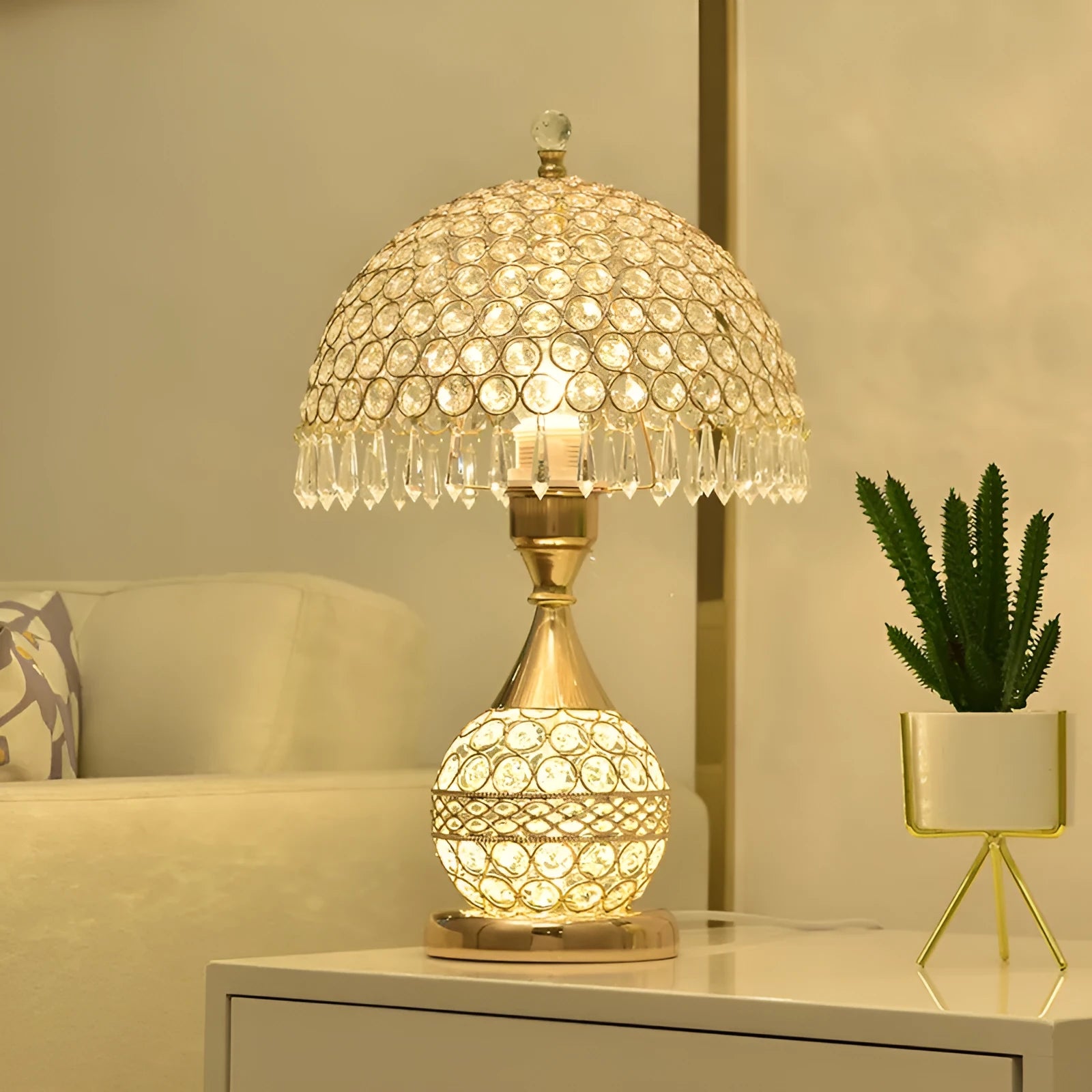 Gold crystal desk lamp with iron art base on a wooden table