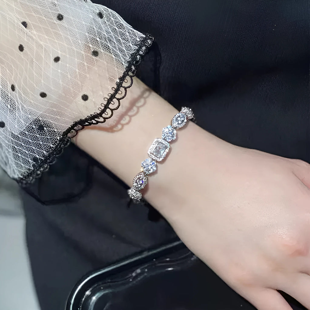 Women's white gold plated geometric bracelet with zircon stones in two length options.