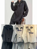 Women's knitted sweater suit two-piece set with top and trousers in neutral colours