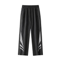 Men's straight leg summer sports trousers in grey, showing loose fit and button fly.