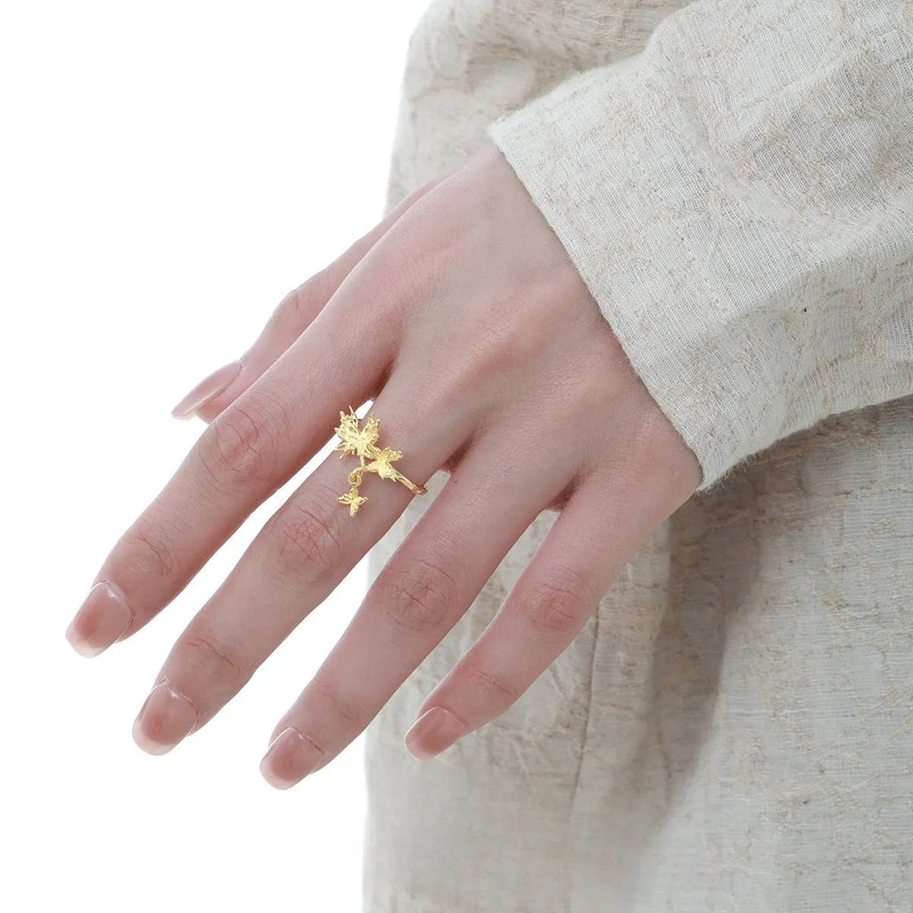 Adjustable silver butterfly ring with white gold or 18K gold electroplating, showing insect motif and open band design