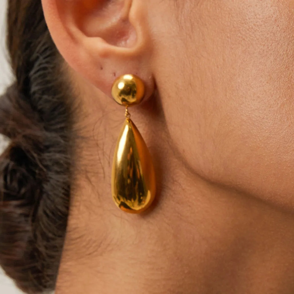 Gold stainless steel water drop pendant earrings with geometric hemisphere design