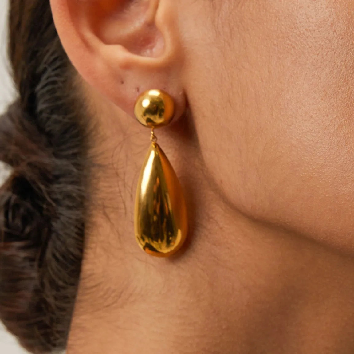 Gold stainless steel water drop pendant earrings with geometric hemisphere design