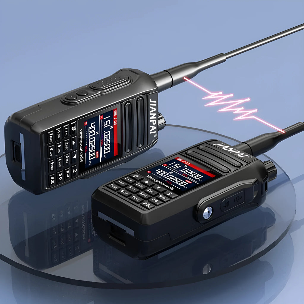 Black Interphone aviation communication headset with microphone, battery, antenna, and charging accessories on a flat surface.