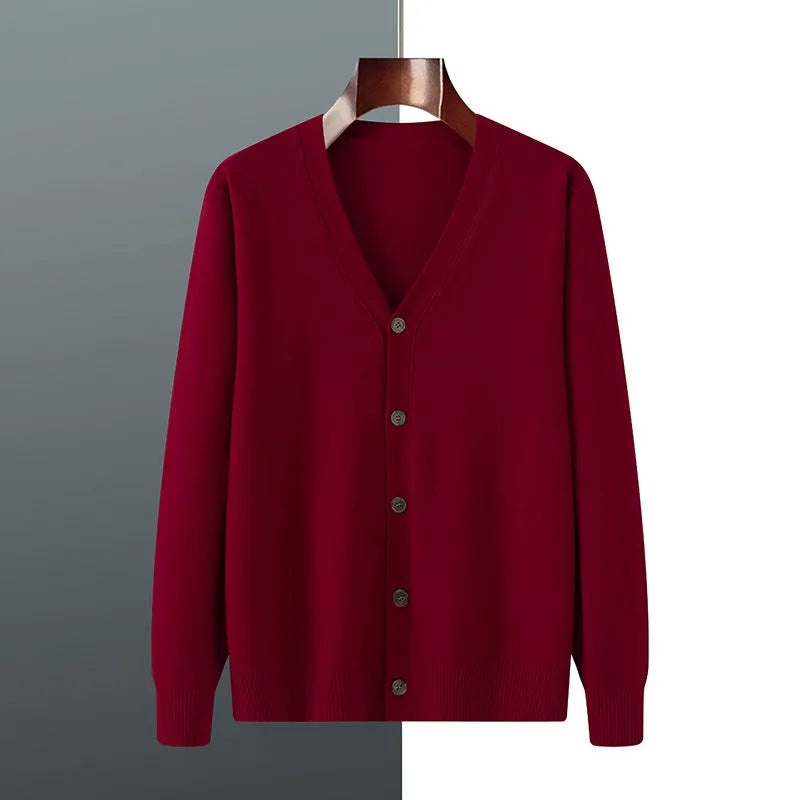 Man wearing a loose V-neck cardigan coat in Andy Velvet fabric, showing the long sleeves and available colour options.