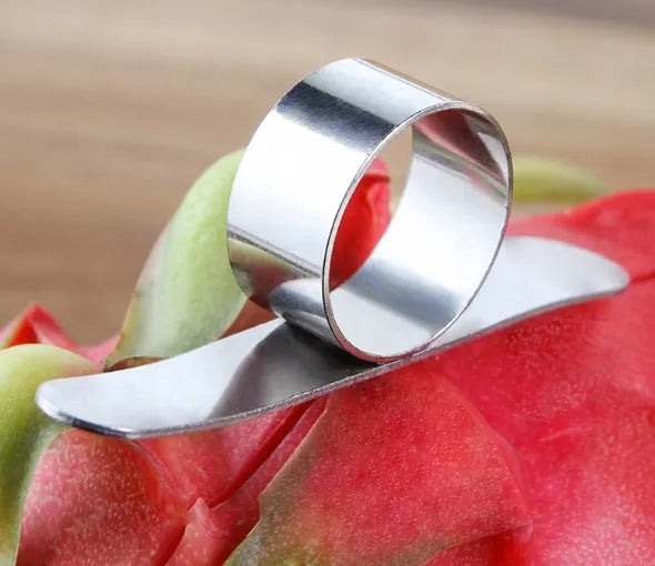 Silver stainless steel ring orange peeler on white background showing 7.5cm tool with finger ring