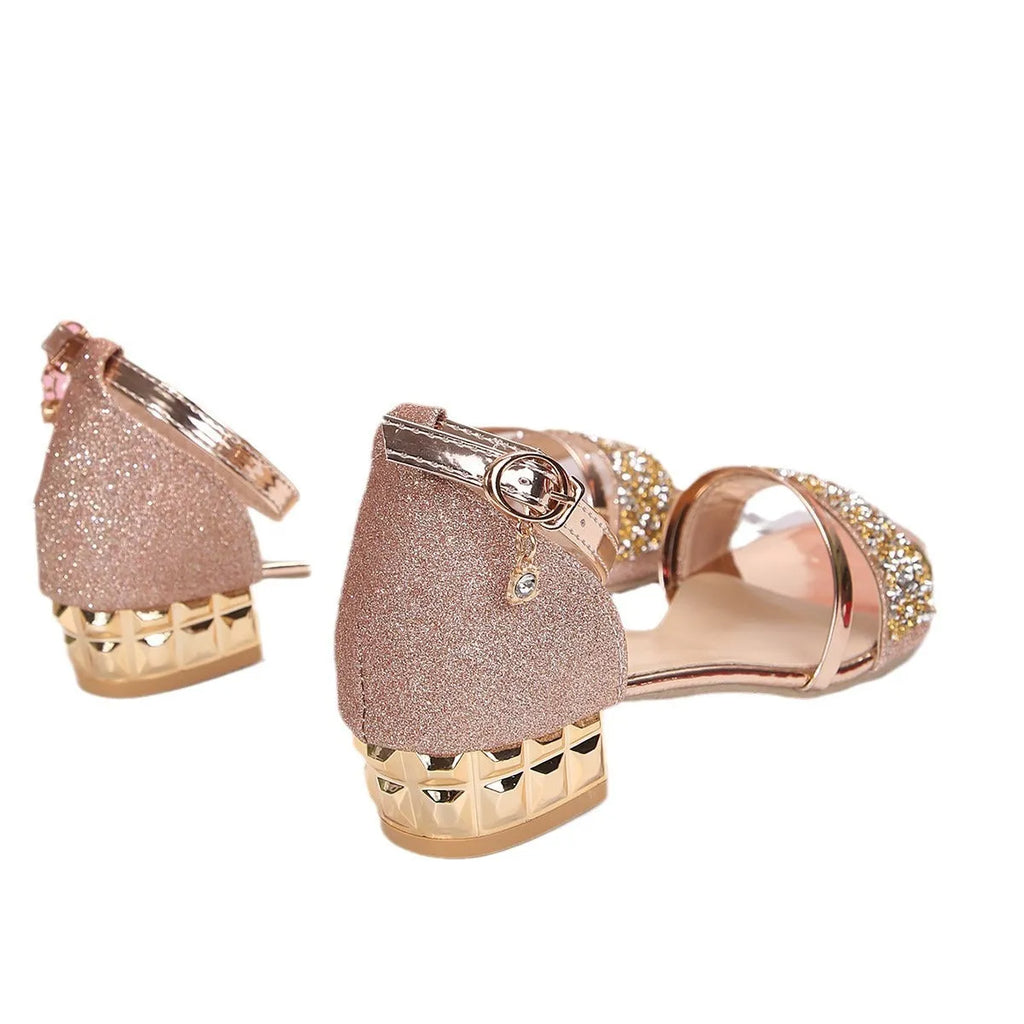 Women's plus size black rhinestone Roman sandal with buckle on a rubber sole.