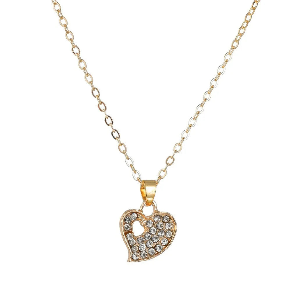 Gold-tone women's jewellery set with adjustable necklace, earrings, and hand decoration featuring love heart pendant