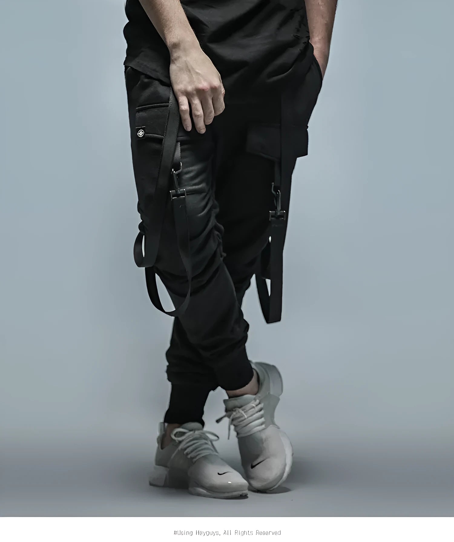 Men's black cotton blend pencil sweatpants with belt, flat lay showing tapered leg and waist elastic