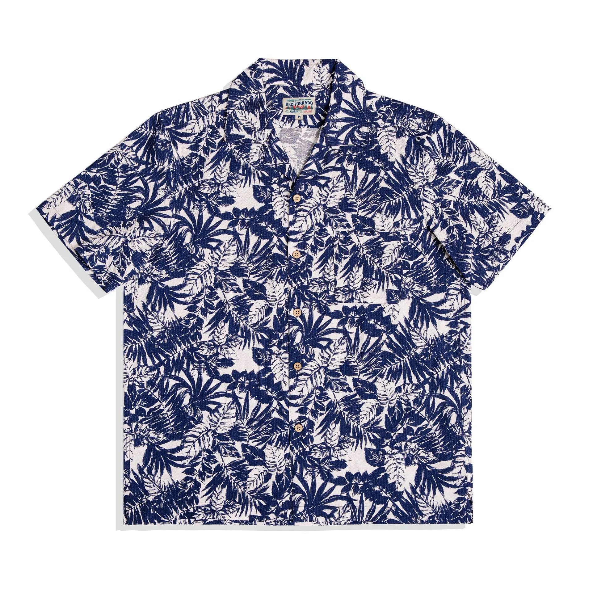 Men's green seersucker shirt with floral print and a Cuban collar, laid flat.