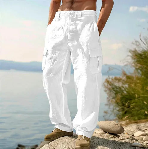 Man wearing light army green loose cotton wide-leg casual trousers with a mid waist.