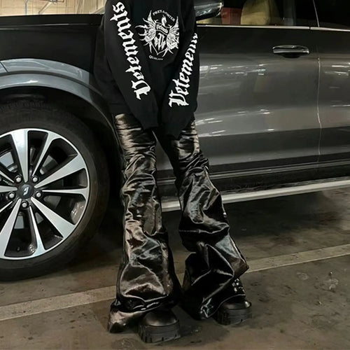 Black shiny patent leather skinny jeans with straight-leg cut and mid-rise waist