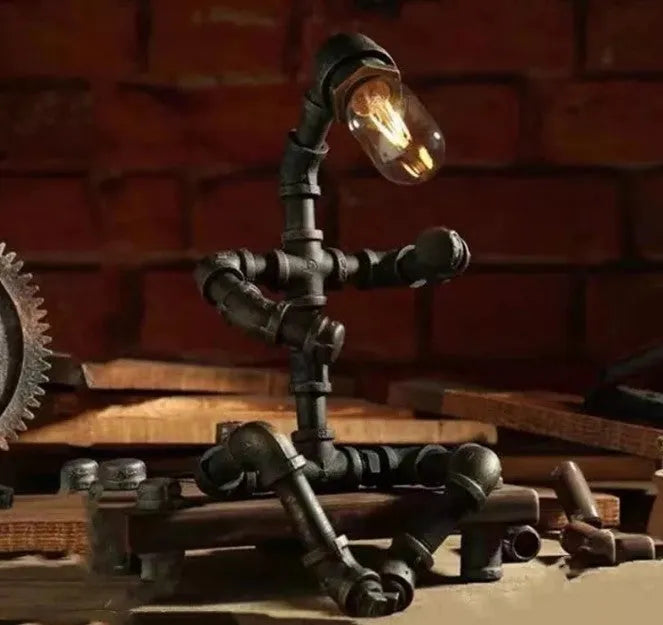Robot vintage industrial table lamp with iron pipe construction in green bronze finish