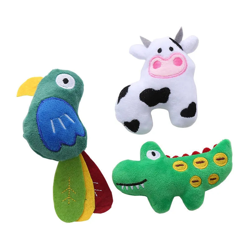 Colourful plush cat toy shaped like a cow, a crocodile, or a parrot on a plain background.