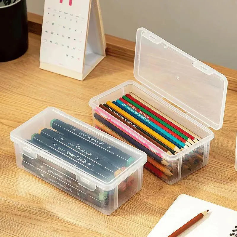 Large clear plastic pencil storage box filled with colouring pencils and crayons.