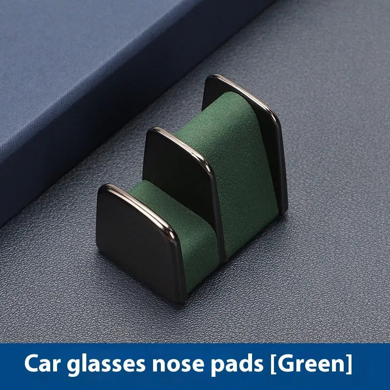 Zinc alloy car glasses clip with leather pad in choice of colours for dashboard or visor.