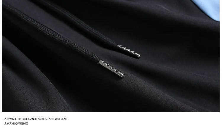 Quick-drying black and grey sports shorts with elastic waist and loose straight-leg design