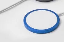 Silver metal Magsafe magnetic wireless charger for iPhone showing magnetic ring.