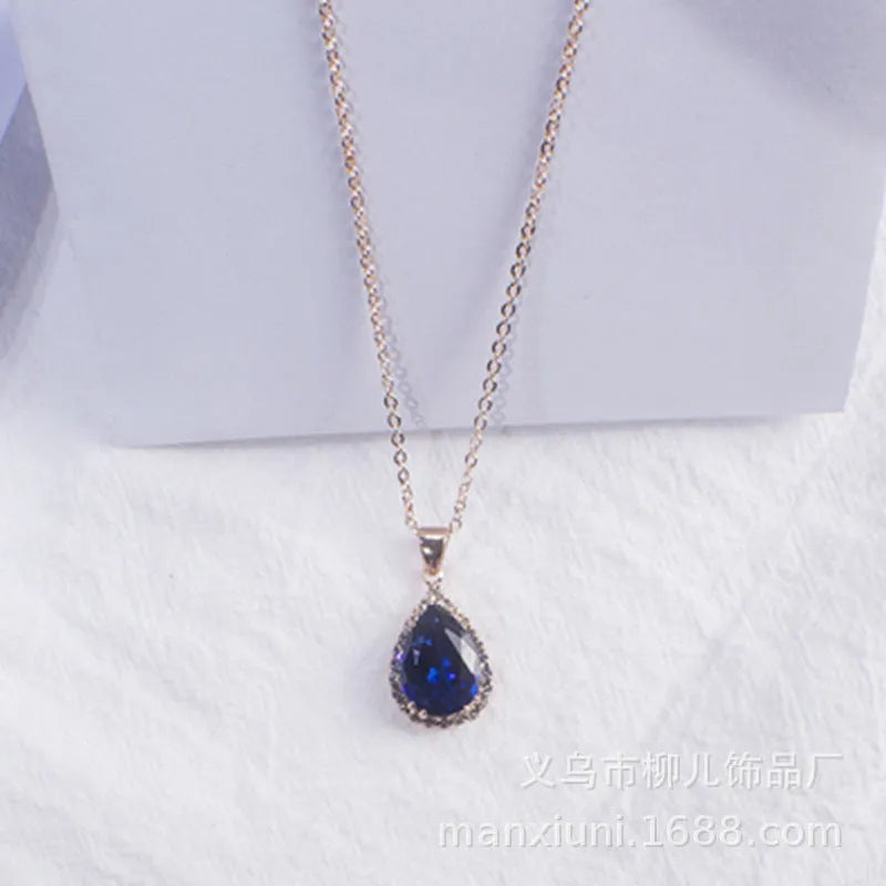 Rose gold water drop shape necklace with rhinestone geometric detailing in pink colour