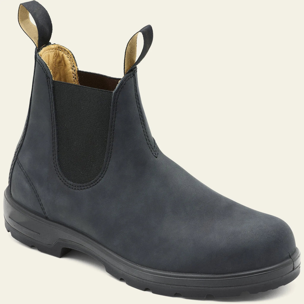 Vintage brown unisex Chelsea boot with frosted PU upper and round toe on a wooden surface.