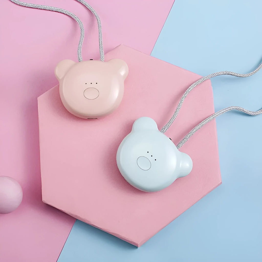 Mini USB portable air purifier necklace in pink, showing compact wearable design.