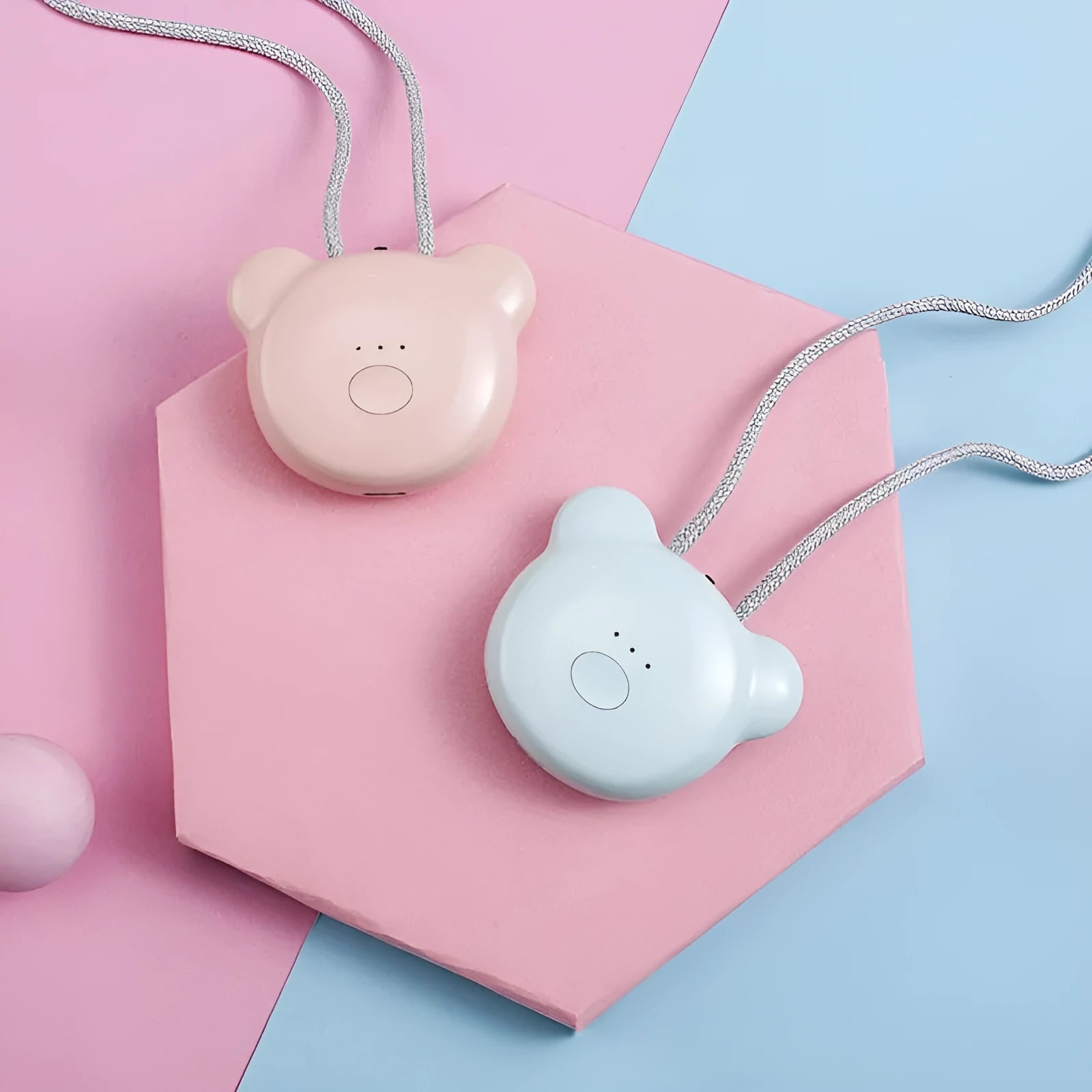 Mini USB portable air purifier necklace in pink, showing compact wearable design.
