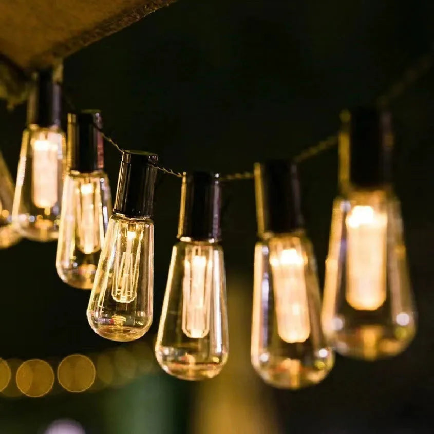 Retro infusion bottle shaped outdoor festoon lights with IP55 rating in earth instrument lighting chain arrangement