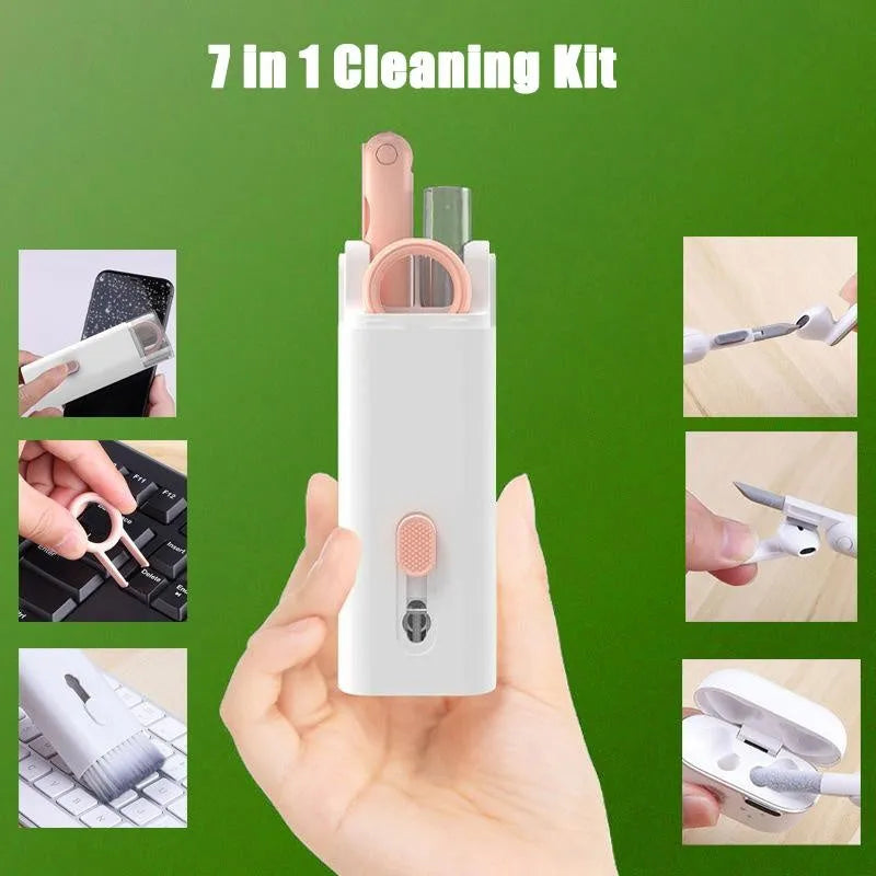 White cleaning set with pen, brush, keycap puller, and spray bottle on desk