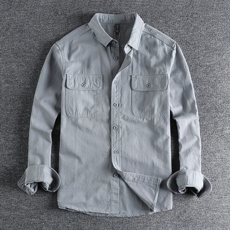 Man wearing loose fit long sleeve shirt overalls in cardigan style, made from polyester fabric