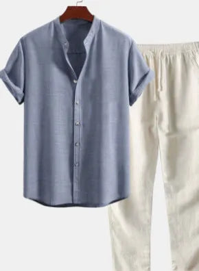 Men's light coloured linen-look casual short sleeve shirt and trouser two-piece suit set on a hanger.
