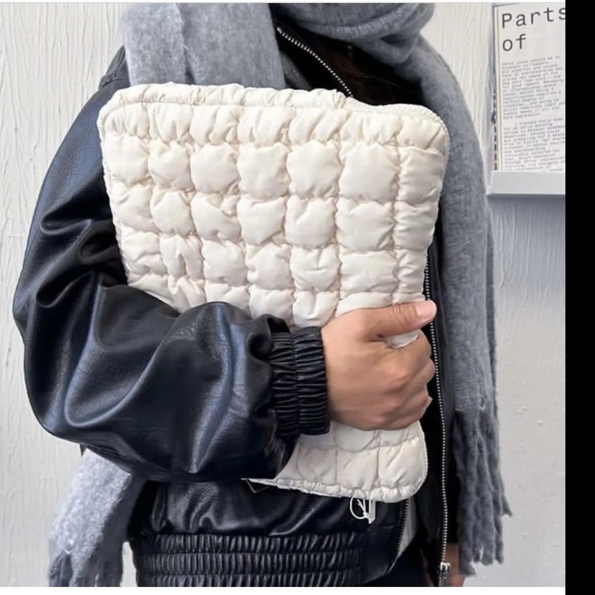 Black and white nylon laptop bag for 11-inch to 15.6-inch devices with large storage capacity.