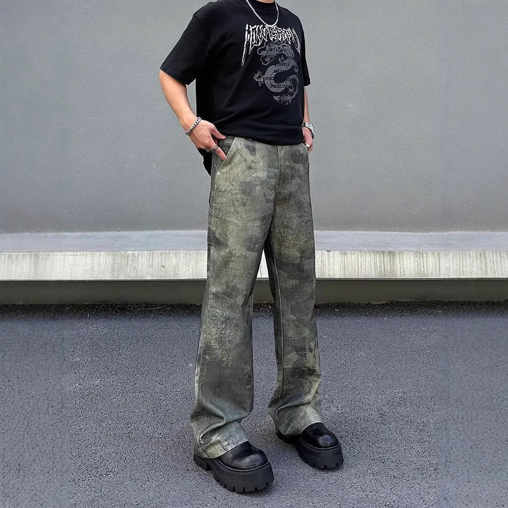 Man wearing retro digital camouflage print straight-leg jeans in cotton denim.