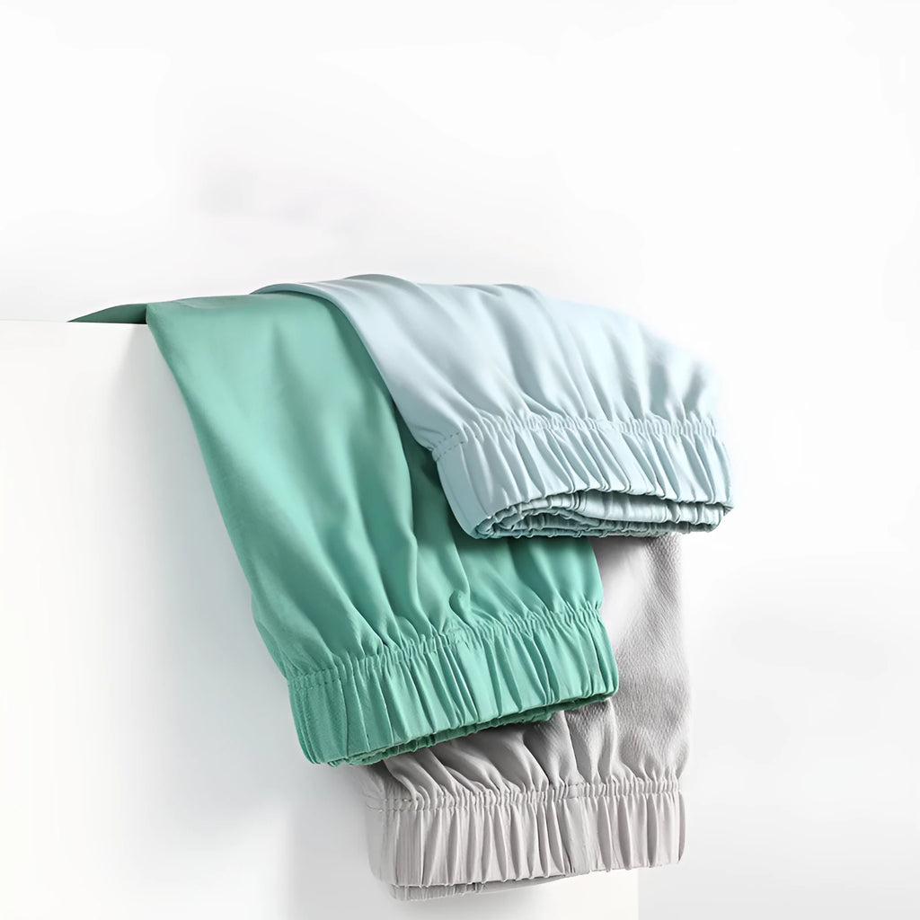 Men's loose-fitting cotton boxer shorts in solid colours like gold and green.