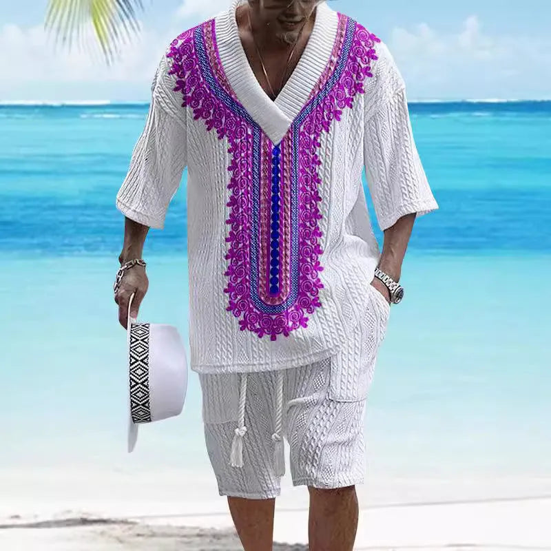 A man wearing a printed drop-shoulder knitted short-sleeved top with matching shorts in a casual setting.