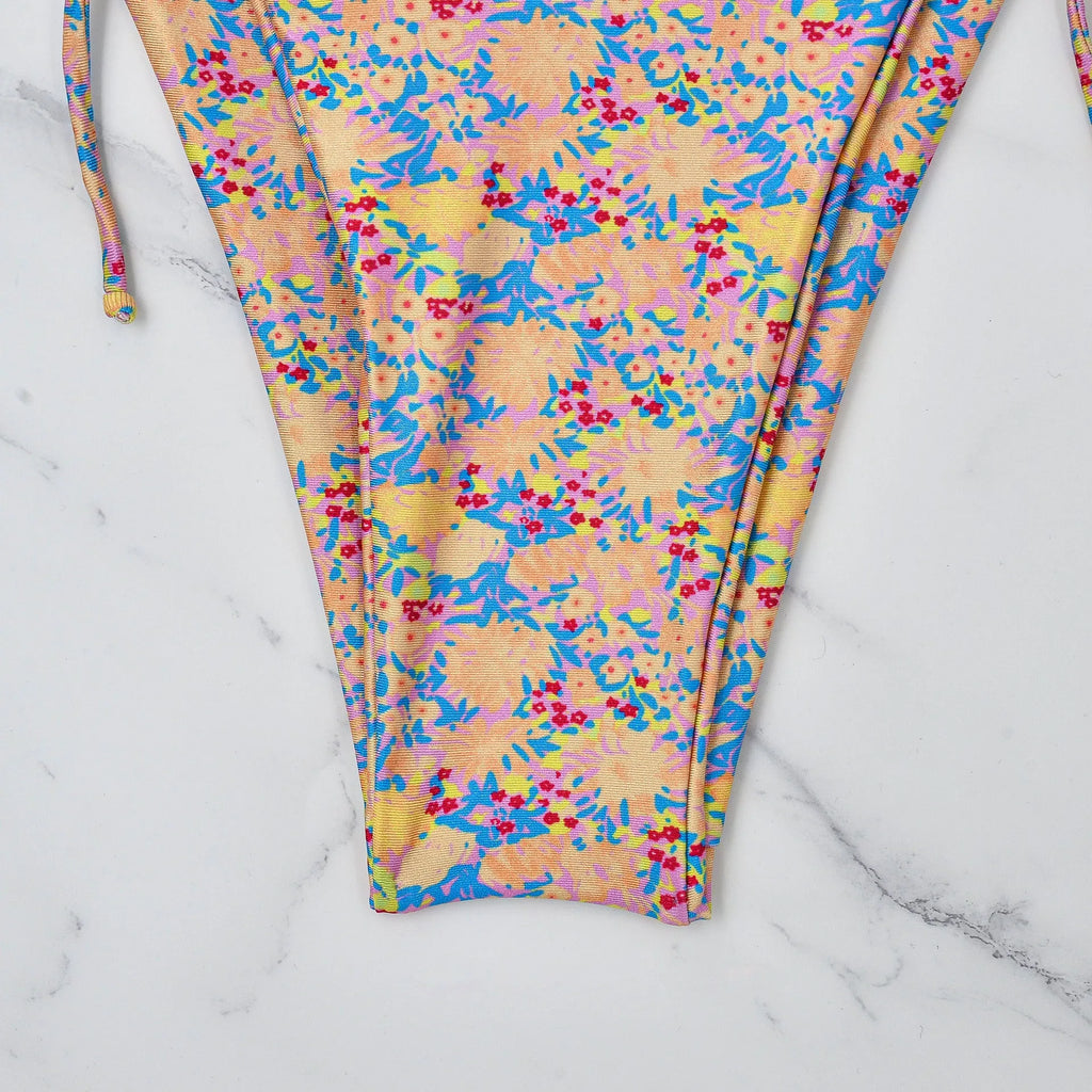 Lace-up bikini swimsuit with backless design and split briefs in polyester fabric