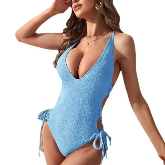 Women's black hollow backless one-piece polyester bikini swimsuit on a mannequin