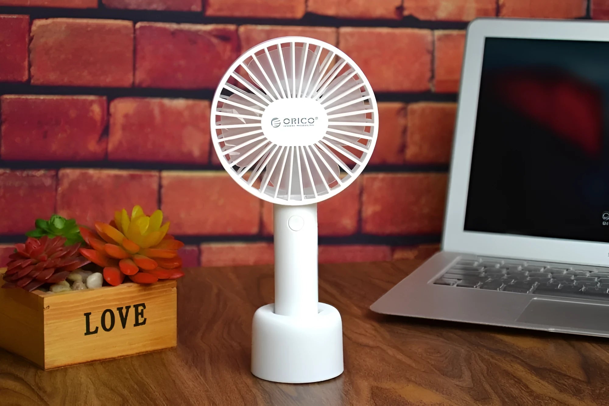 White portable USB desk fan with rechargeable battery, showing three-speed controls and compact design