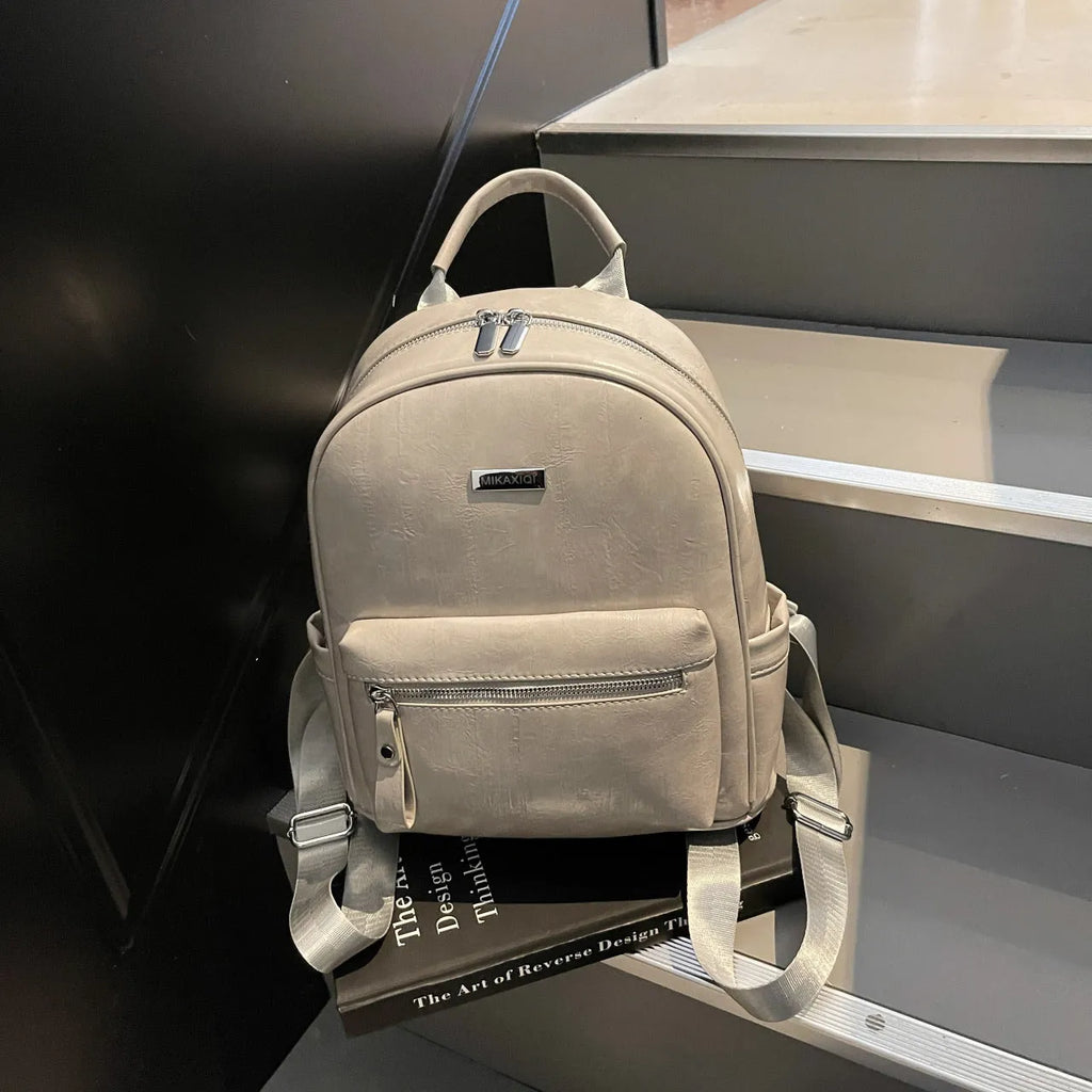 PU leather ladies travel backpack in urban simplicity style with sandwich pocket and polyester lining