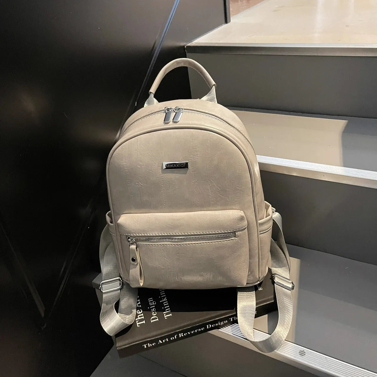 PU leather ladies travel backpack in urban simplicity style with sandwich pocket and polyester lining