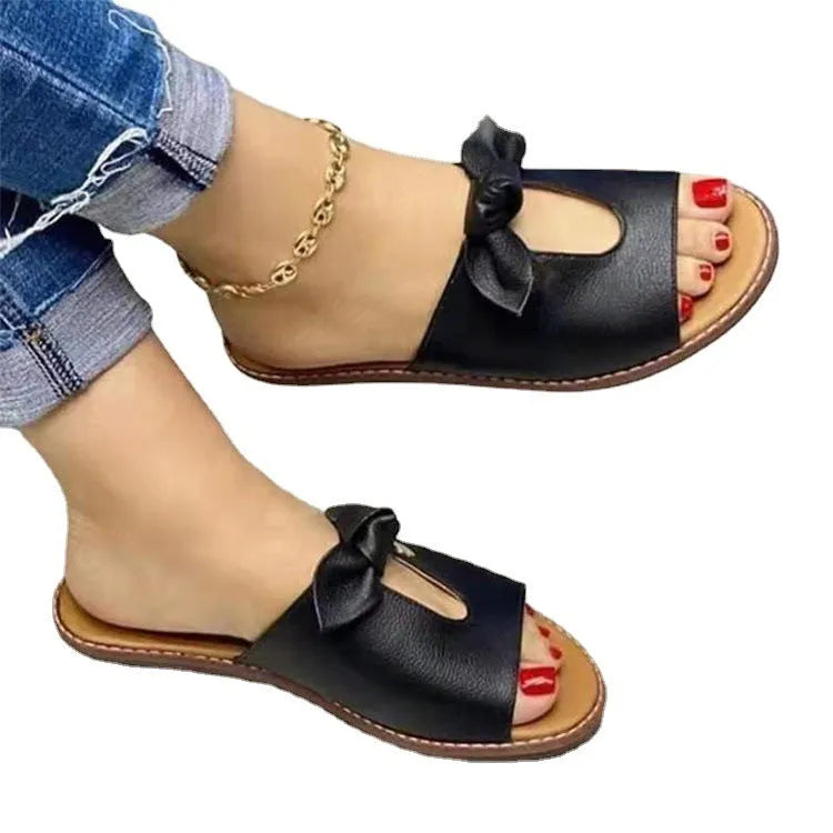 Ladies black fish mouth sandals with a decorative bow on the artificial PU upper.