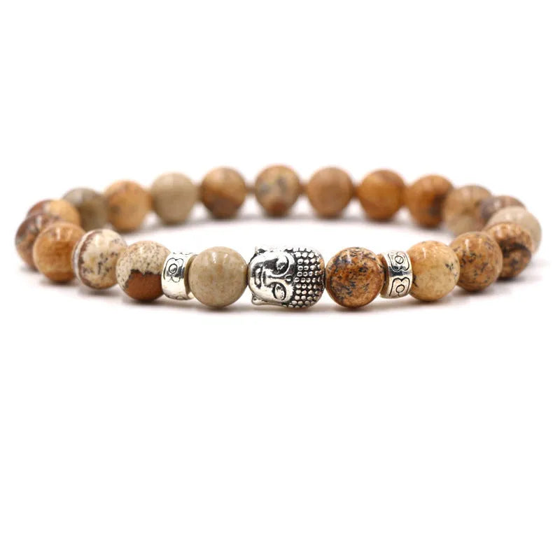 Tigereye stone Buddha head stretch bracelet with 8mm beads on a wrist.