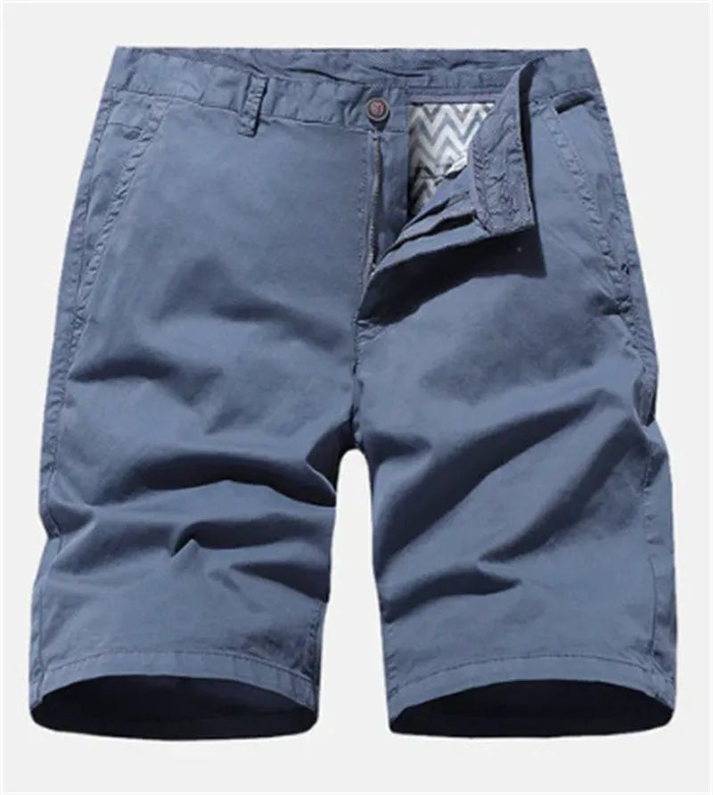 Men's blue denim loose-fit casual shorts with a straight leg and no belt, laid flat.