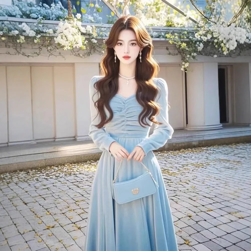 Solid colour fairy dress with mid-waist long sleeves in blue, shown on model