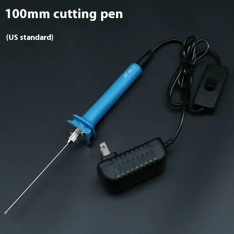 Blue plastic-handled electric foam cutter pen with adapter on a work surface.