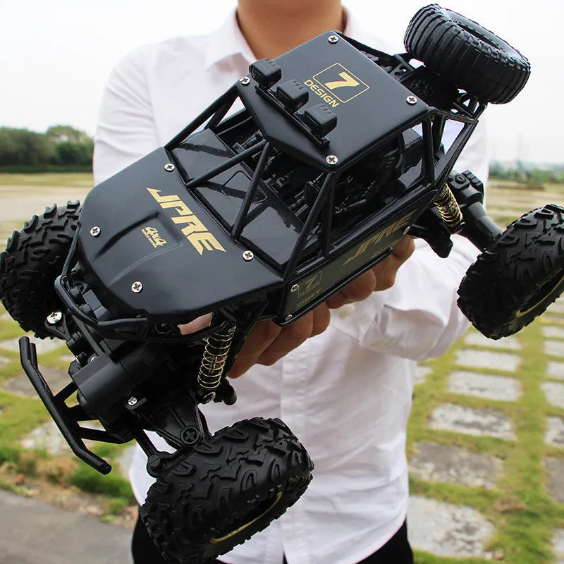 Black and silver 4WD remote control off-road climbing car with 2.4G wireless controller