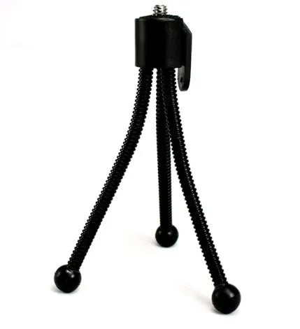 Small black iron frame mini tripod with ball head, shown collapsed to 110mm next to a mobile phone.