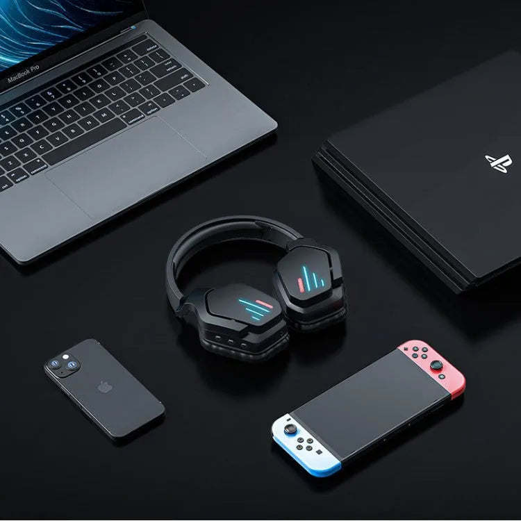 Luminous black wireless gaming headphones showing head-mounted design and included 3.5mm cable.